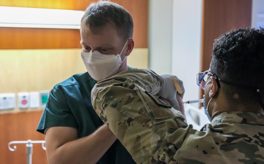Lt. Col. Brian Cohee, an Army doctor, was the first U.S. service member to receive the Moderna COVID-19 vaccination in South Korea at Camp Humphreys, South Korea, Tuesday, Dec. 29, 2020.
