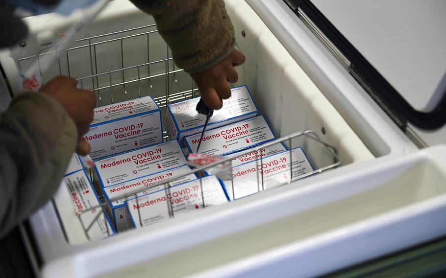 Senior Airman Shaneshia Lindsey unpacks coronavirus vaccines at Osan Air Base, South Korea, on Monday, Dec. 28, 2020.