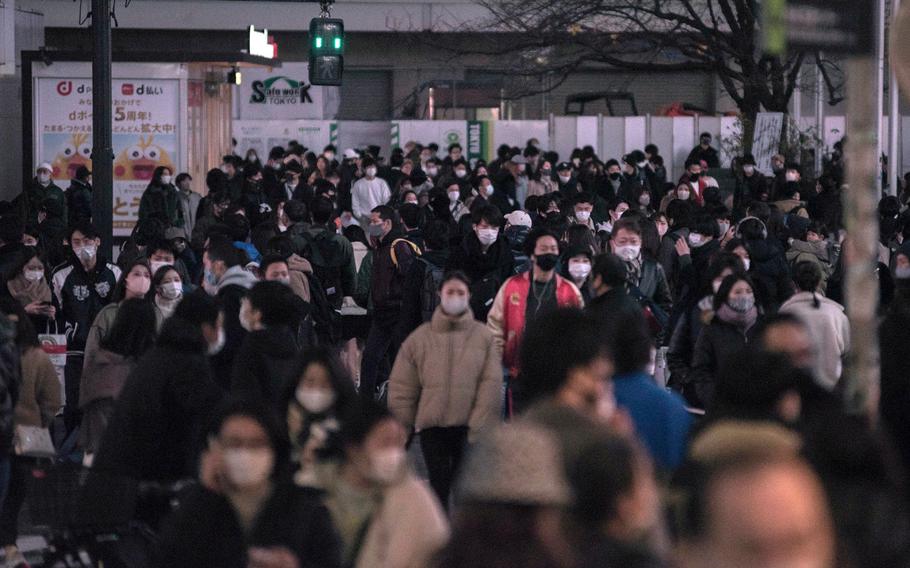 Crowds still gathered at the famous Shibuya crossing in central Tokyo on Dec. 20, 2020.  