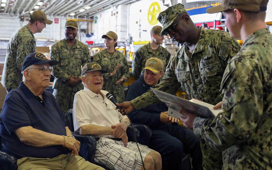 Dan Crowley talks with sailors aboard the USS Bataan on April 26, 2019, at the amphibious assault ship's homeport of Naval Station Norfolk, Va.