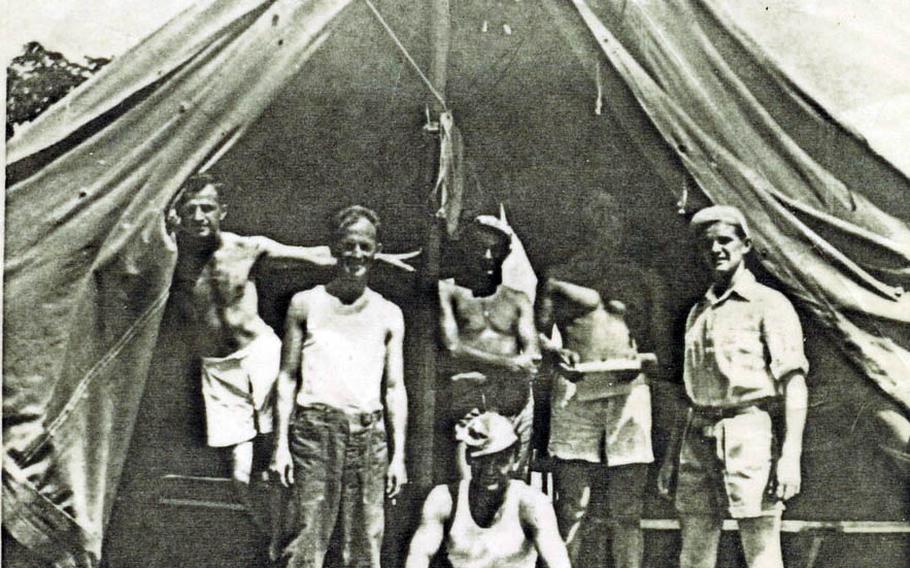 Dan Crowley, far right, stands by a tent in this undated photo taken with other service members in the Philippines during World War II.