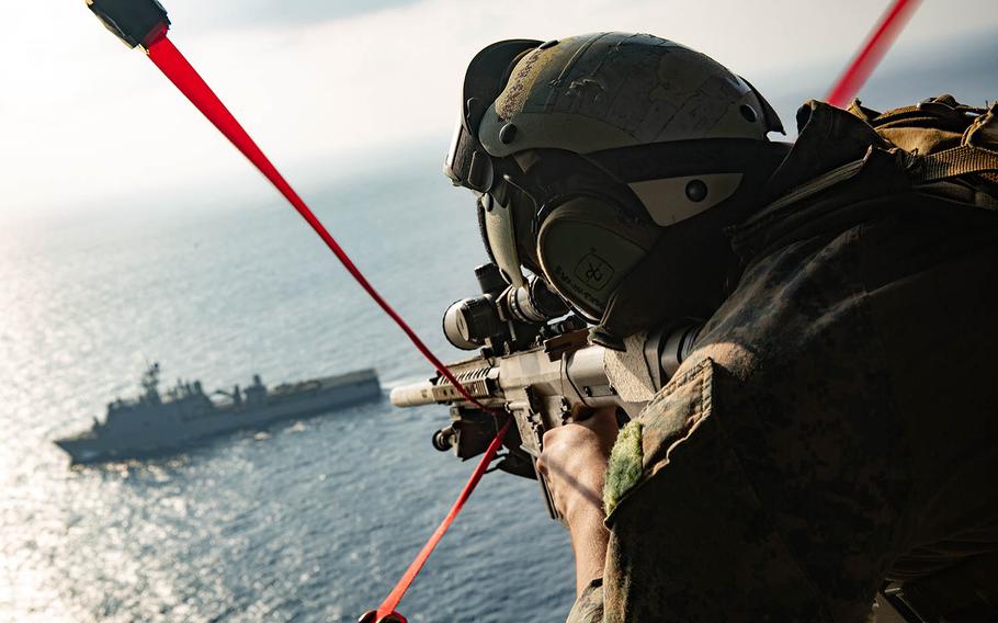 Cpl. Richard Simons IV of the Maritime Raid Force, 31st Marine Expeditionary Unit provides aerial security during an exercise in the South China Sea, Sept. 6, 2020.  