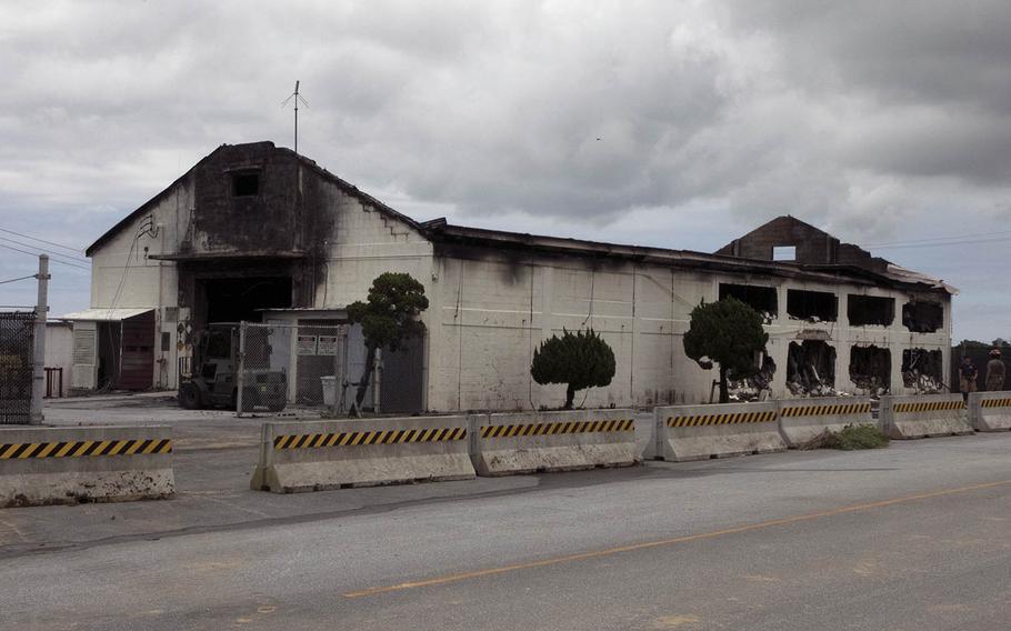 An Air Force Ground Accident Investigation Board report blamed improperly stored chemicals for a fire that destroyed a warehouse at Kadena Air Base, Okinawa, on June 22, 2020.