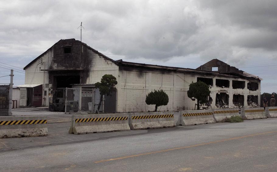 An Air Force Ground Accident Investigation Board report blamed improperly stored chemicals for a fire that destroyed a warehouse at Kadena Air Base, Okinawa, on June 22, 2020. 