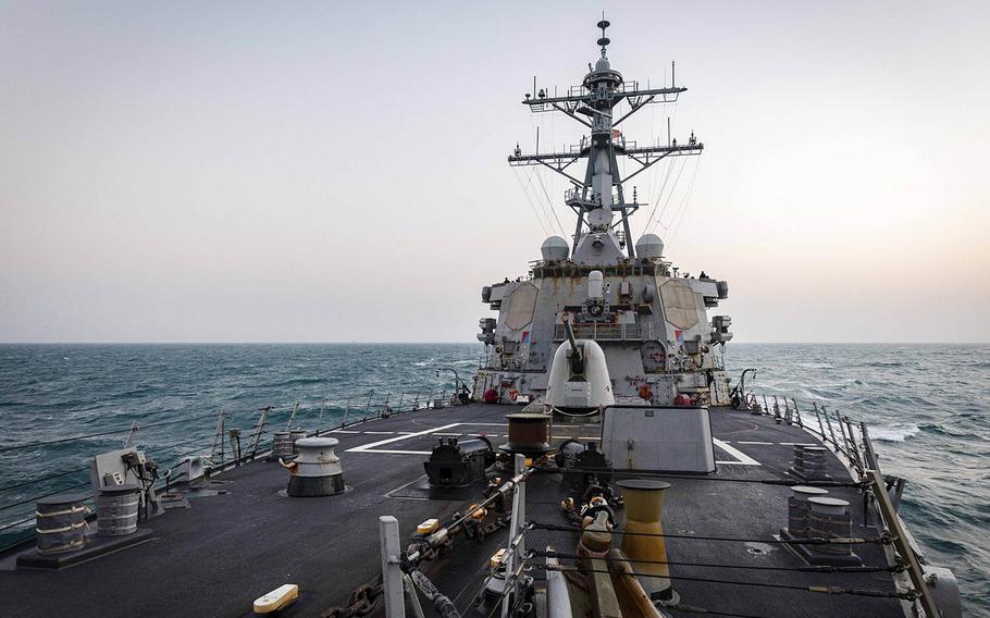 The guided-missile destroyer USS John S. McCain steams near the Paracel Islands in the South China Sea, Friday, Feb. 5, 2021. 