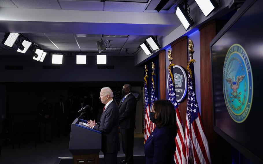 President Joe Biden speaks as Secretary of Defense Lloyd Austin and Vice President Kamala Harris accompany him at the Pentagon, Wednesday, Feb. 10, 2021, in Washington. 