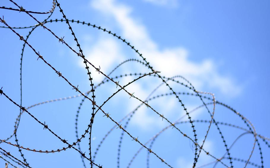 Barbed and concertina wire top a security fence near the border between North and South Korea, May 24, 2017. 