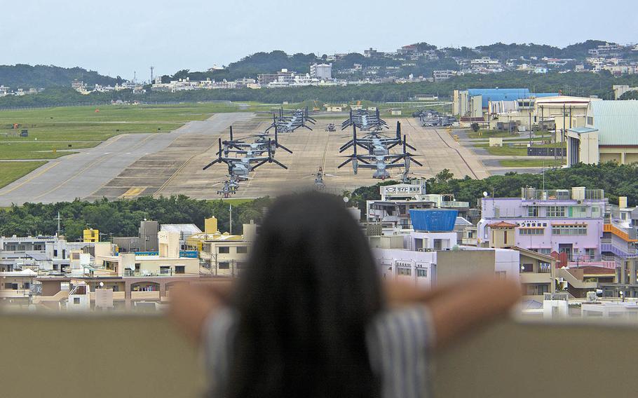 A child looks out at Marine Corps Air Station Futenma, Okinawa, April 19, 2019.