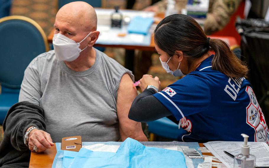 Ernest Lee, Veterans of Foreign Wars community director and a U.S. military retiree living in South Korea, receives his first dose of the Moderna COVID-19 vaccine at Osan Air Base, Feb. 5, 2021. 