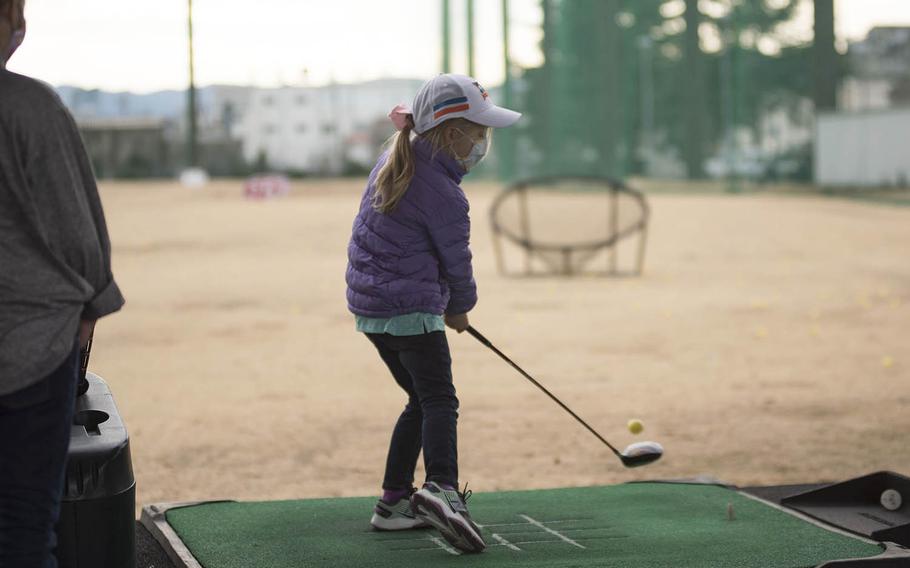 Emily Nelson participates in a junior golf practice session at Yokota Air Base in western Tokyo, Thursday, Feb. 18, 2021. 