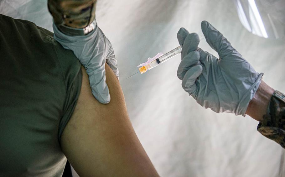 A Marine receives the Moderna COVID-19 vaccine at the naval hospital on Camp Foster, Okinawa, Feb. 18, 2021. 