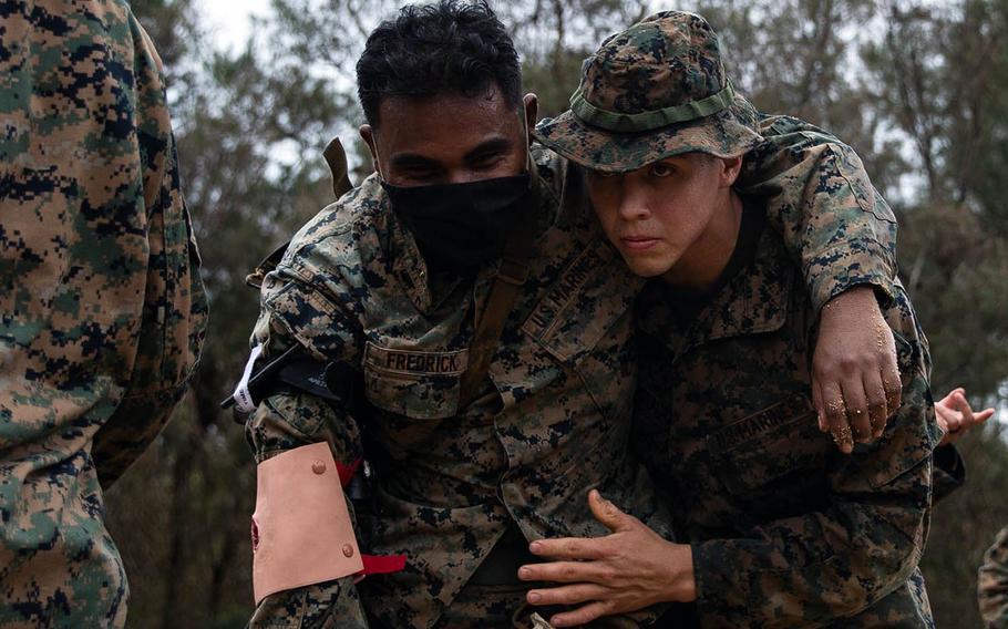 Then-Lance Cpl. Rene PonceAvalos, right, helps a simulated casualty during a humanitarian assistance and disaster-relief exercise at Okinawa's Kin Blue training area, Sept. 9, 2020. PonceAvalos died Sunday, Feb. 28, 2021, after surfing near Ikei Island.