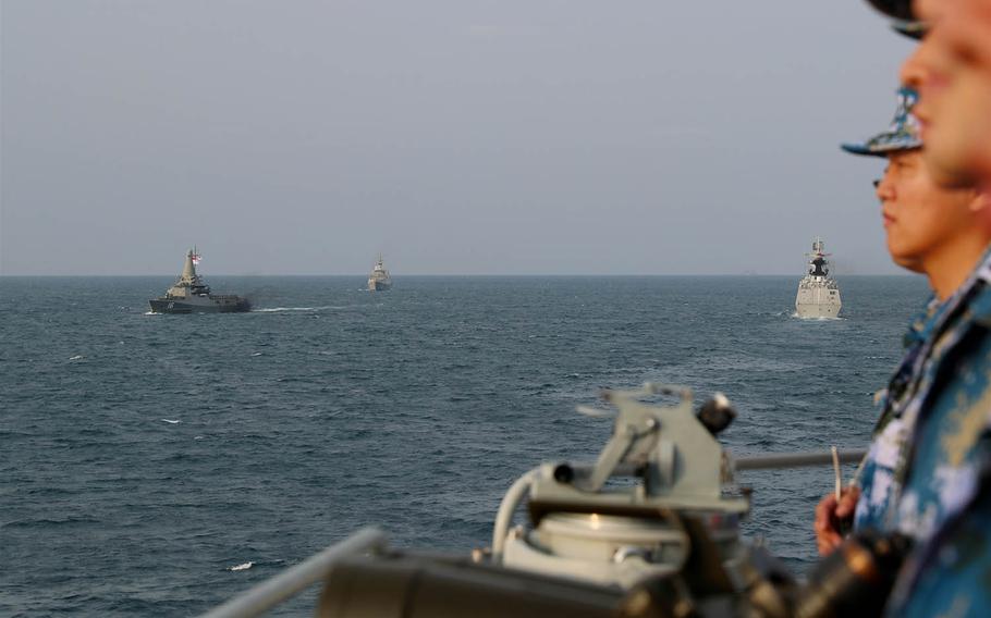 Chinese warships steam through the South China Sea during an exercise with the Singaporean navy, Feb. 24, 2021. 