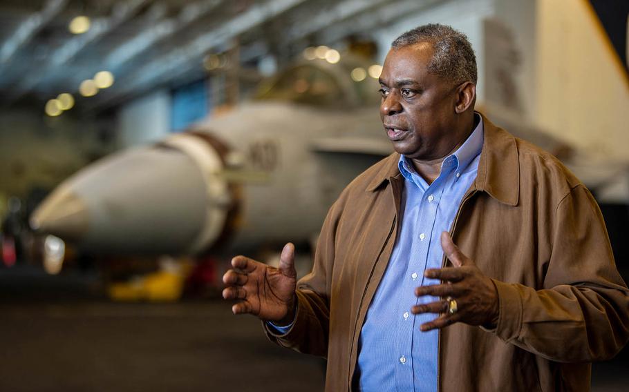 Secretary of Defense Lloyd Austin speaks with reporters aboard the USS Nimitz aircraft carrier off the California coast, Feb. 25, 2021.