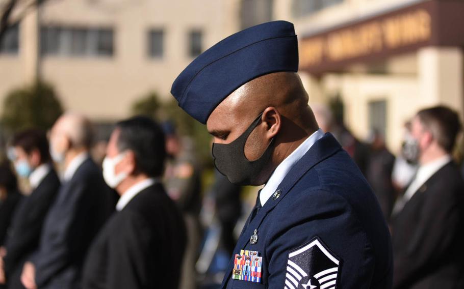 Master Sgt. Joshua Brown, who flew eight Operation Tomodachi missions as a C-130H flight crew chief, attends a ceremony at Yokota Air Base, Japan, Thursday, March 11, 2021, marking 10 years since the Great East Japan Earthquake. 

