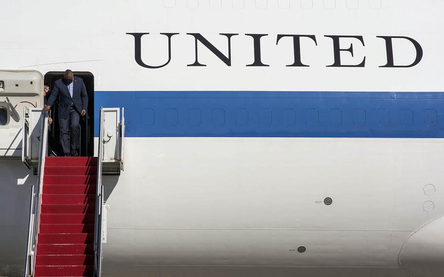 Secretary of Defense Lloyd Austin arrives at Yokota Air Base for his first visit to Japan as Pentagon chief, Monday, March 15, 2021. 