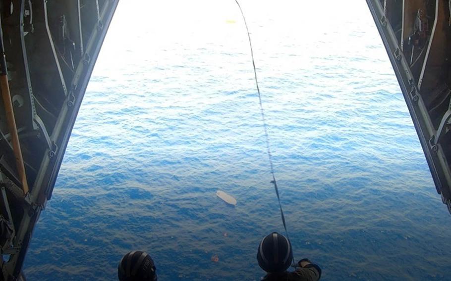 Crew members aboard Coast Guard and Air Force planes coordinated with a merchant ship Friday, March 12, 2021, in the rescue of five mariners on a skiff near Houk Island, Chuuk.