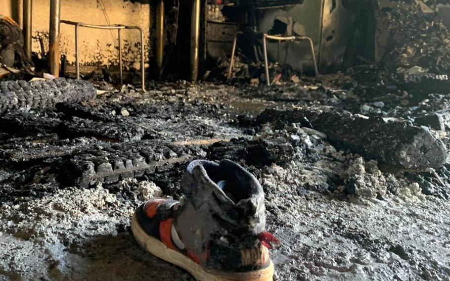 A military family was checked for smoke inhalation after a fire destroyed their home at Yokota Air Base, Japan, Tuesday, March 23, 2021.  
