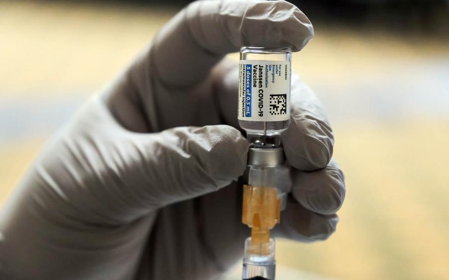 An airman prepares a dose of the one-shot COVID-19 vaccine made by Johnson & Johnson at Osan Air Base, South Korea, March 11, 2021.