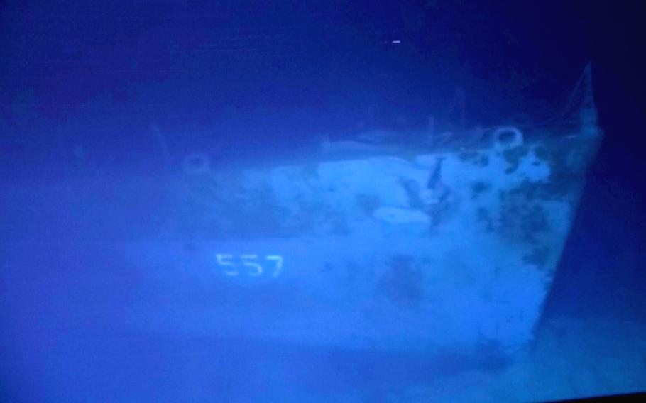 The hull number 557 on the USS Johnston is visible four miles below the surface of the Philippine Sea in a photo taken by divers in March 2021.