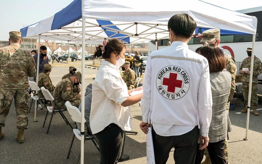 Korean Red Cross representatives prepare for a blood drive at Camp Humphreys, South Korea, Wednesday, April 7, 2021.