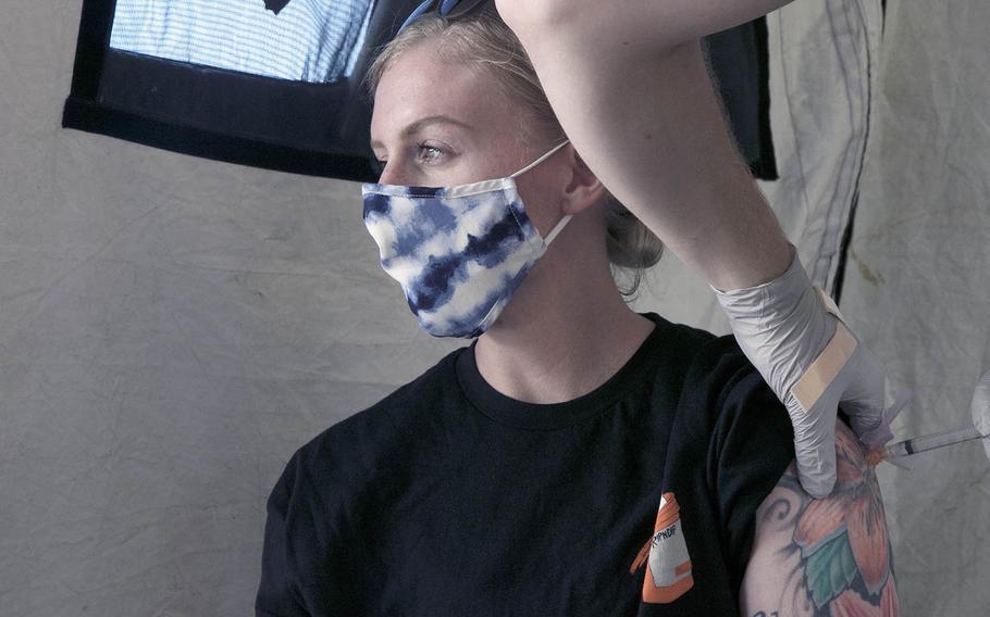 Niki Franceschi, 30, a spouse and Marine veteran from Ohio, receives the one-shot vaccine by Johnson & Johnson at Camp Foster, Okinawa, Tuesday, April 13, 2021. 
