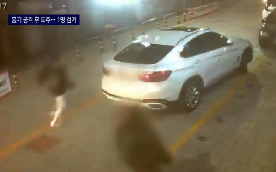 This screenshot from a Channel A News broadcast shows closed-circuit TV footage of suspects fleeing the scene after a U.S. soldier was stabbed at a bar near Camp Humphreys, South Korea, April 17, 2021.