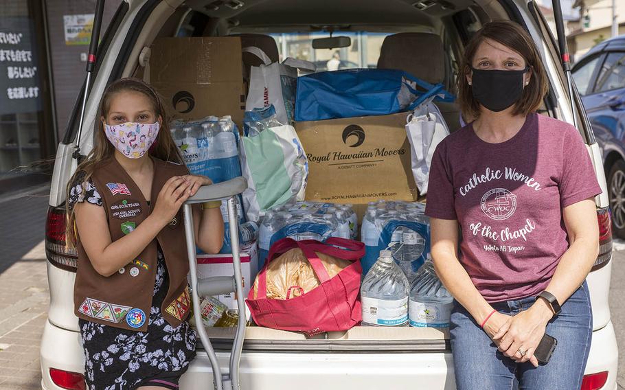 This month, Girl Scout Eleanor Pierson, 9, and her mother Danielle collected more than 500 bottles of water and hundreds of nonperishable goods for the homeless near Yokota Air Base in Tokyo, working on crutches after dropping two cans of food and injuring her toe. 