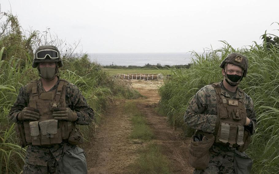 Members of Marine Wing Support Squadron 172 guard an expeditionary fuel depot and landing pad during an exercise on Ie Shima, Okinawa, April 16, 2021.