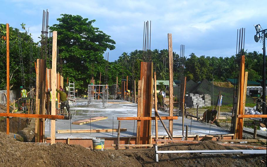 U.S. Marines and Philippine soldiers work together to build elementary school classrooms in Ilosong, Philippines, April 7, 2021.