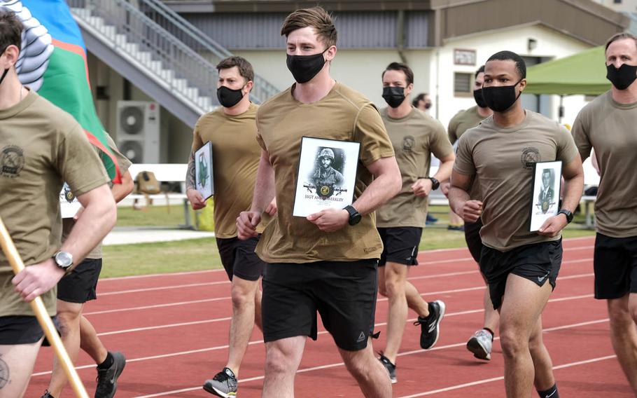 Special warfare airmen participate in the 10th annual 24-hour Challenge Run to honor 12 fallen members of the Air Force's Tactical Air Control Party at Camp Humphreys, South Korea, April 29, 2021.