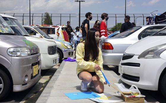 High school seniors decorate their cars to show off their post-graduation plans during a Decision Day parade at Yokota Air Base, Japan, Friday, April 30, 2021.