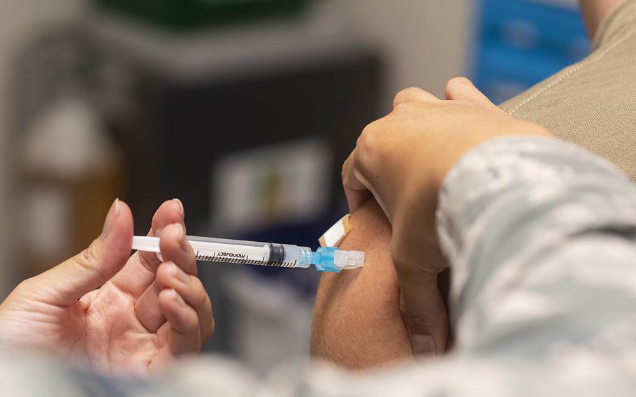 An airman receives his first dose of the Moderna COVID-19 vaccine earlier this year at Andersen Air Force Base on Guam. 