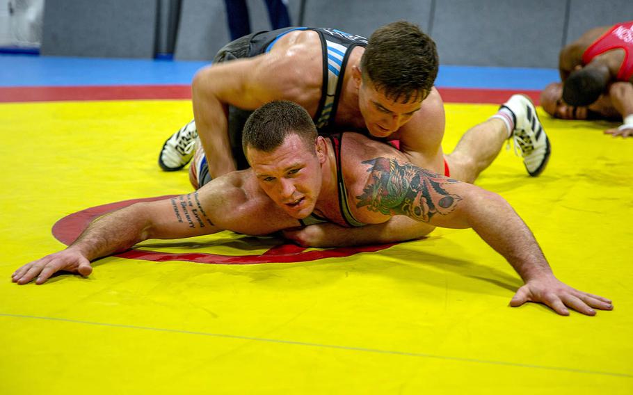 U.S. Marine Corps Staff Sgt. John Stefanowicz, bottom, and Capt. Peyton Walsh prepare for the Olympic Trials at Marine Corps Air Station New River, N.C., Jan. 8, 2021.