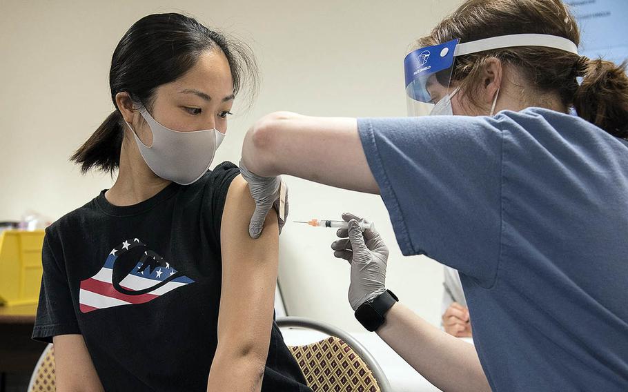 Navy spouse Aya Lizama receives the Moderna COVID-19 vaccine at Naval Air Facility Atsugi, Japan, May 7, 2021.