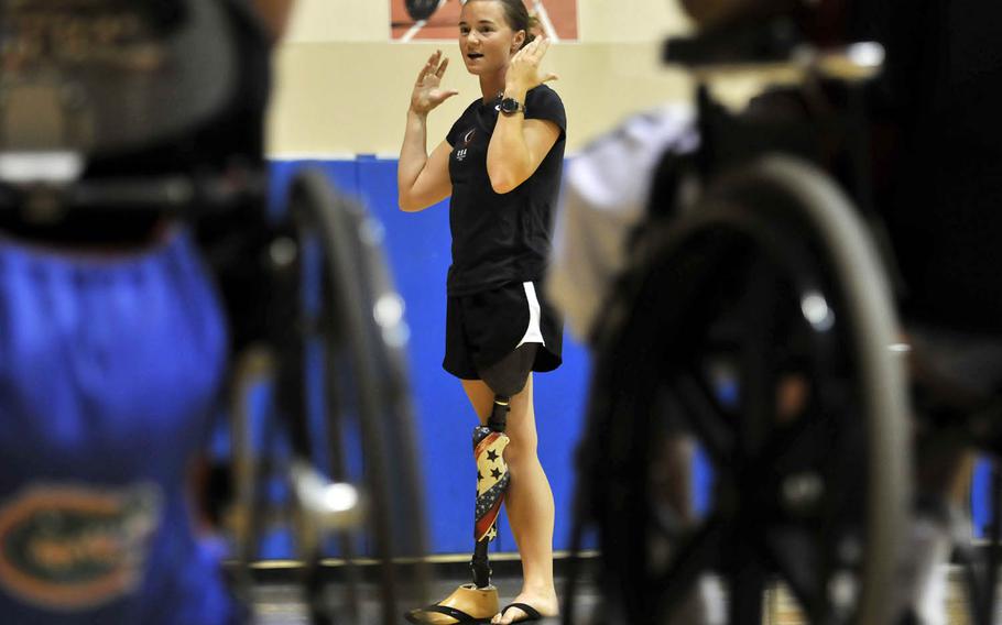 Former Army soldier Melissa Stockwell speaks to her injured service members at San Diego's Balboa Naval Medical Center in 2010. 