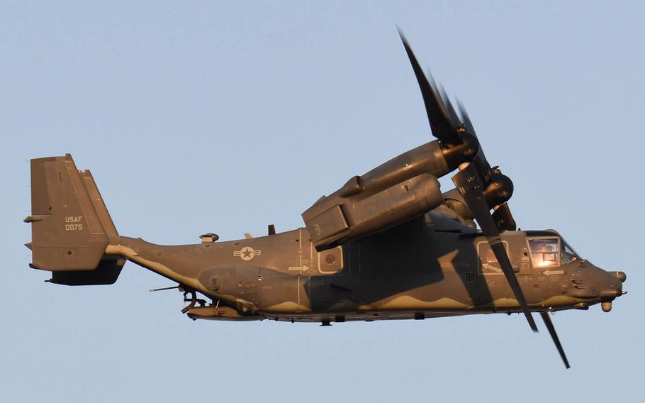 An anti-base group near Yokota Air Base in western Tokyo is complaining that CV-22 Ospreys have been flying over residential areas with their machine guns visible. The Air Force says the guns are only loaded for use over approved training areas.