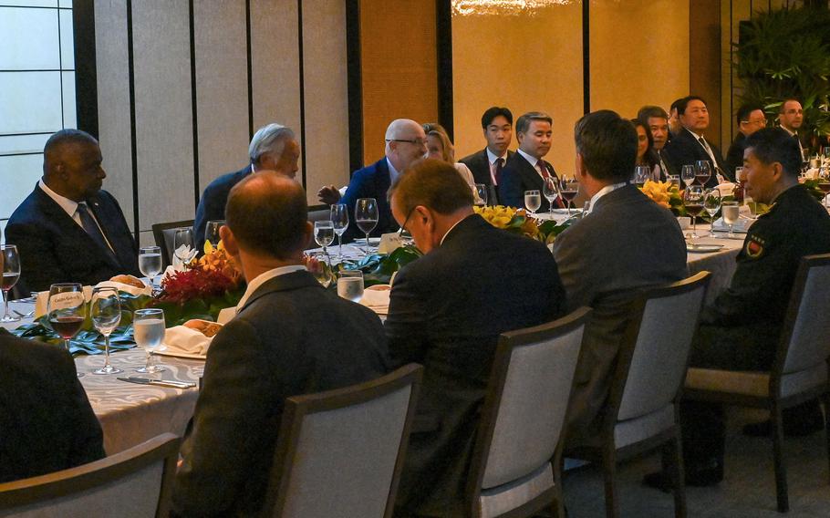 US Secretary of Defense Lloyd Austin (L) and China's Defense Minister Li Shangfu (R) attend ministerial luncheon at the 20th Shangri-La Dialogue summit in Singapore on June 3, 2023. 