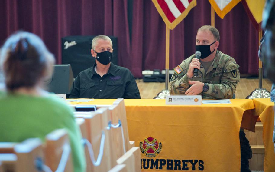 Jeff Arrington, left, superintendent for Department of Defense Education Activity schools in South Korea, and Col. Michael Tremblay, commander of Camp Humphreys, address parents' concerns about the upcoming school year during a meeting inside a chapel on the garrison, Wednesday, July 29, 2020.
