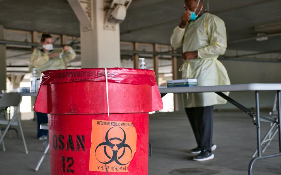 Service members from the 51st Medical Operations Squadron prepare to administer coronavirus tests at Osan Air Base, South Korea, July 14, 2020.