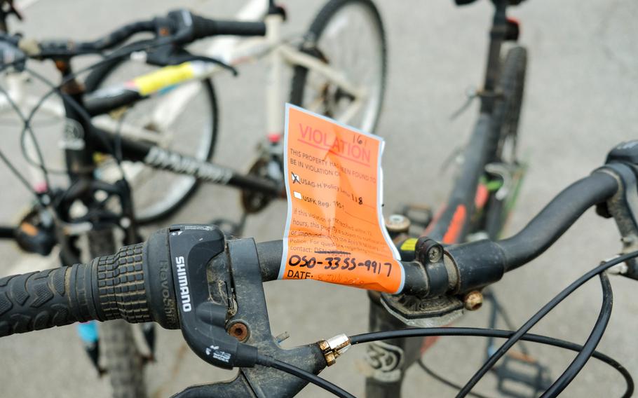 A violation tag is attached to an abandoned bicycle being donated by military police at Camp Humphreys, South Korea, Saturday, Aug. 22, 2020. 