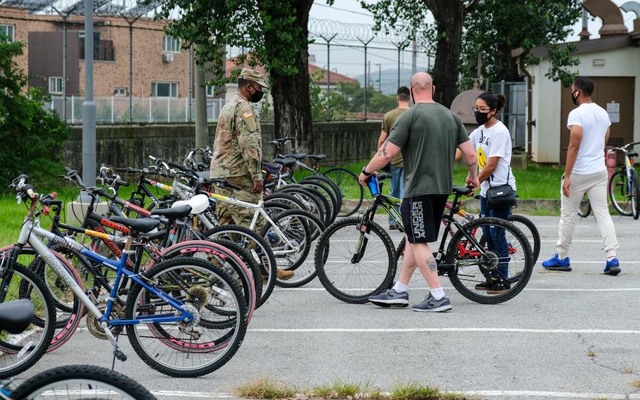 About 300 people waited their turn on Saturday, Aug. 22, 2020, to pick from nearly 250 bicycles abandoned at Camp Humphreys, South Korea. 
