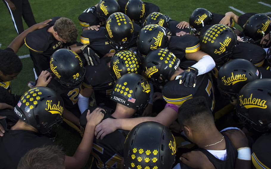 The Kadena Panthers huddle on the home field before a matchup against the Nile C. Kinnick Devils, Friday, Oct. 18, 2019. 