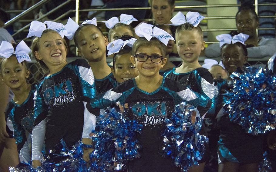 Oki Minis cheerleaders attend a game between the Kadena Panthers and Nile C. Kinnick Devils at Kadena Air Base, Japan, Friday, Oct. 18, 2019.