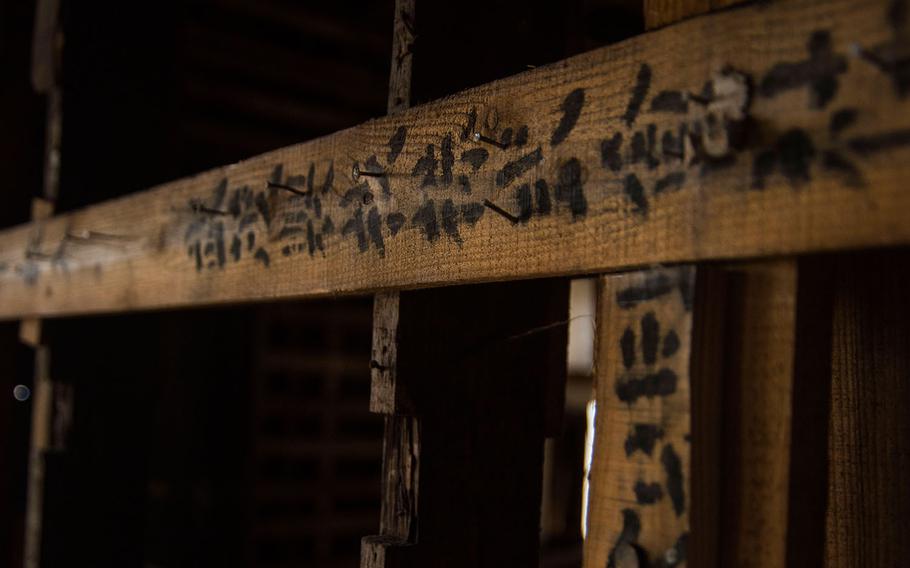 Japanese writing that predates World War II is visible on beams on Oct. 10, 2019, inside an 80-year-old hangar that's scheduled for demolition at Yokota Air Base, Japan.