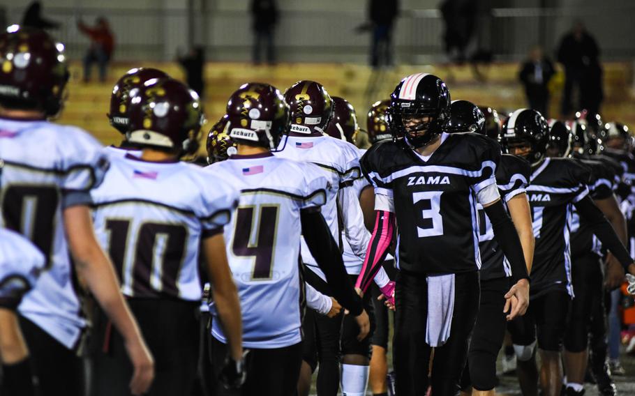 Players from the Matthew C. Perry High School Samurai shake hands with members of the Zama American-High School Trojans after their game at Camp Zama, Friday, Oct. 25, 2019. 