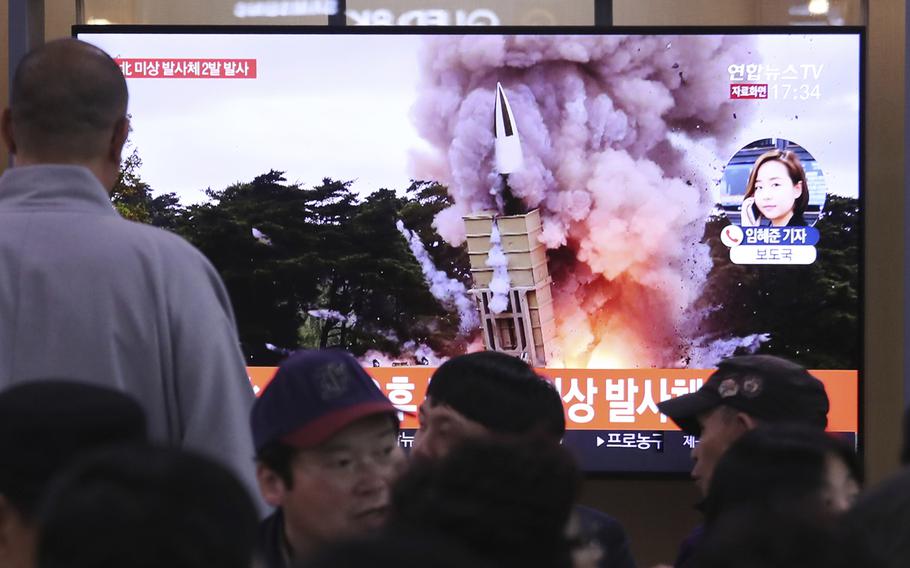 People watch a TV showing a file image of an unspecified North Korea's missile launch during a news program at the Seoul Railway Station in Seoul, South Korea, Thursday, Oct. 31, 2019. 