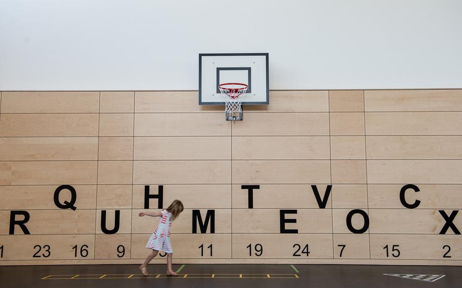 Evelyn Koch plays in the gym at the new Vogelweh Elementary School, Saturday, Aug. 24, 2019.  

