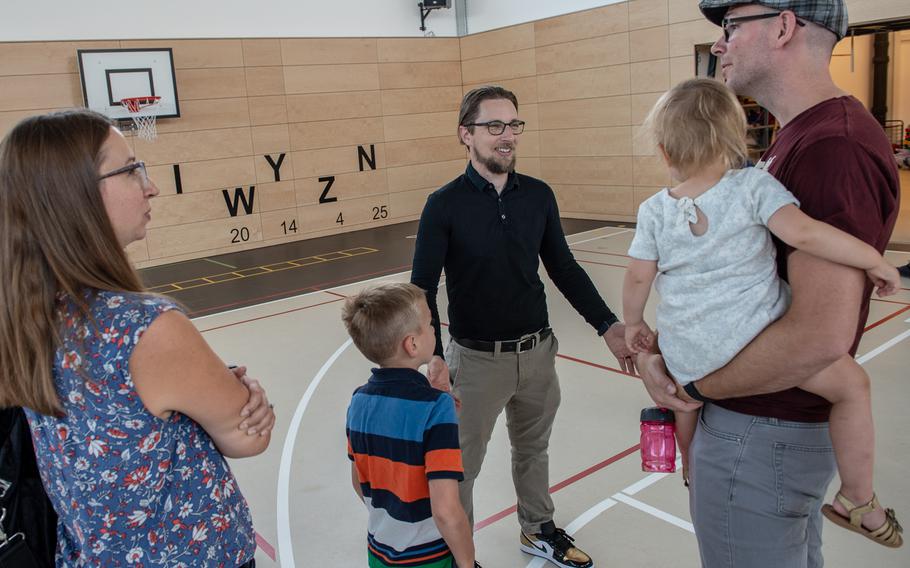 Principal David Lee talks with the Koch family during second grade orientation at the new Vogelweh Elementary School, Saturday, Aug. 24, 2019.  
