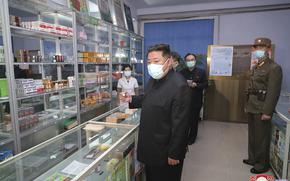 In this photo provided by the North Korean government, North Korean leader Kim Jong Un, center, visits a pharmacy in Pyongyang, North Korea Sunday, May 15, 2022. Independent journalists were not given access to cover the event depicted in this image distributed by the North Korean government. The content of this image is as provided and cannot be independently verified.   Korean language watermark on image as provided by source reads: "KCNA" which is the abbreviation for Korean Central News Agency. 